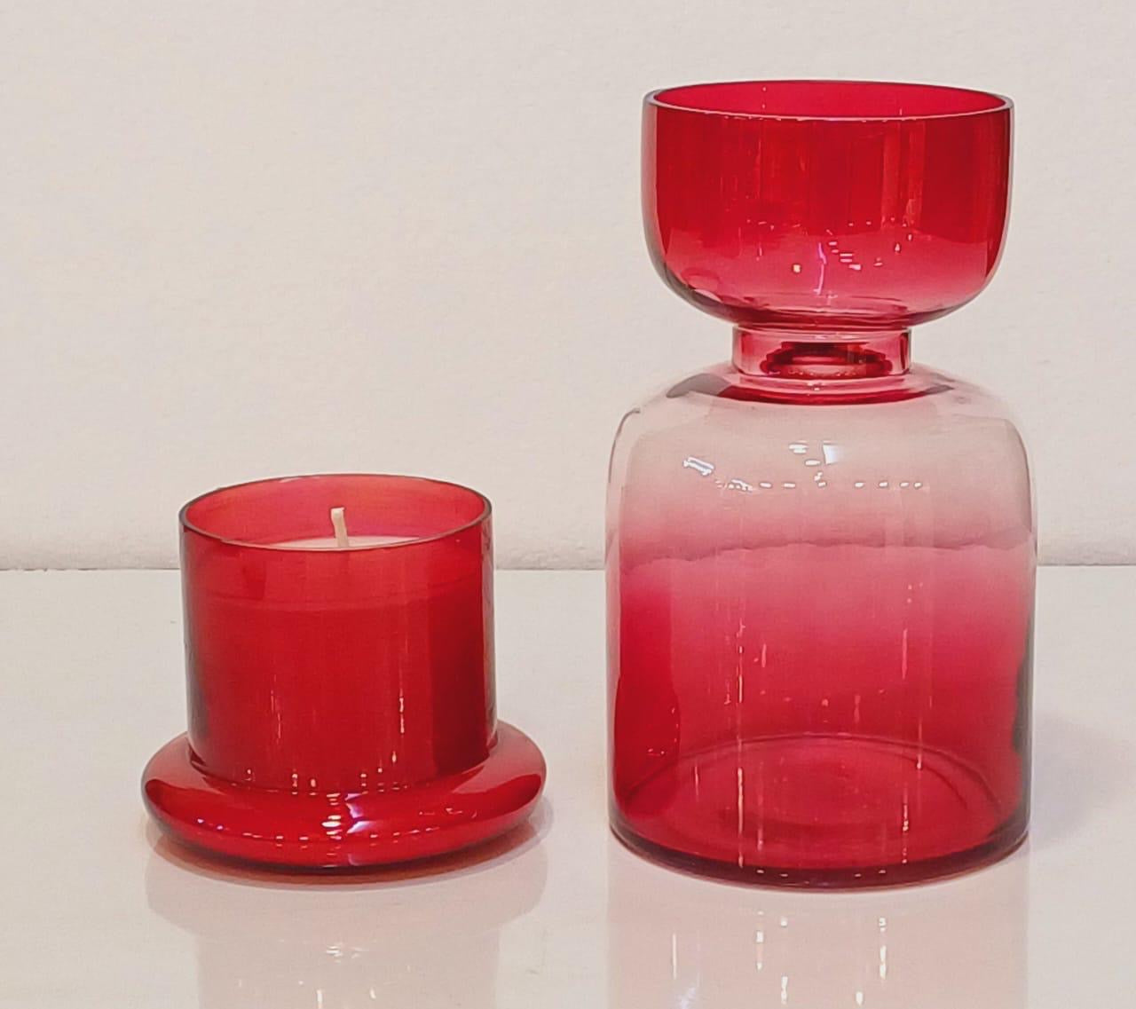 red dome candle and vase